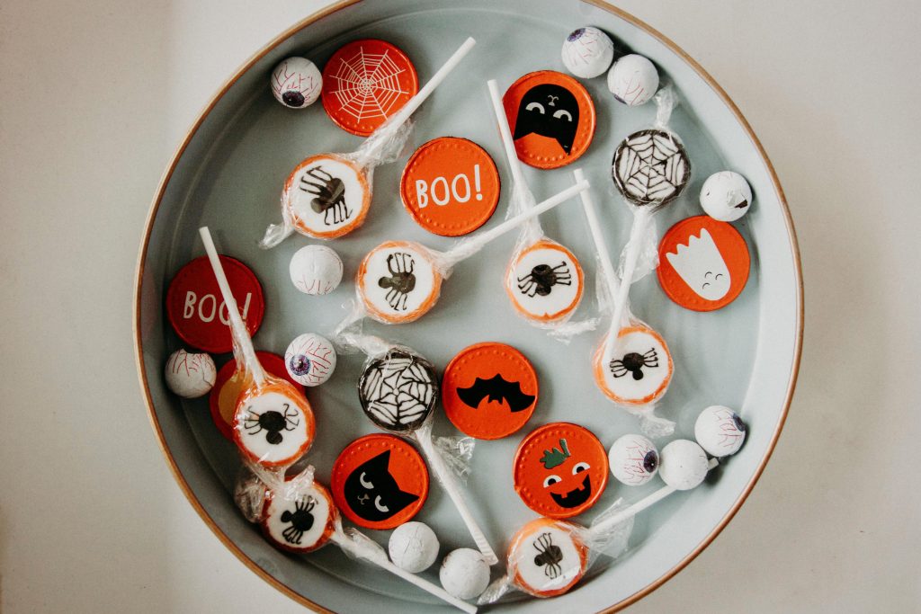 A vibrant assortment of Halloween-themed candies in a bowl, perfect for seasonal celebrations.